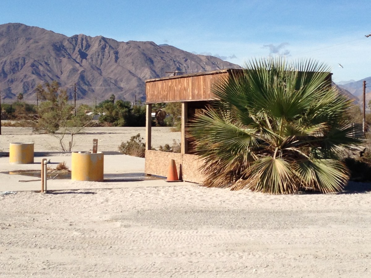 Fish cleaning shack and desert mountains